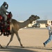 Soldier Enjoys Camel Ride at Kuwait Base