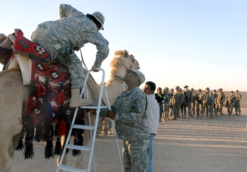 Troops Enjoy Camel Ride at Camp Buehring in Kuwait