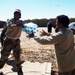 Iraqi Citizens Receive Water Supplies from U.S. Troops in Narhwan