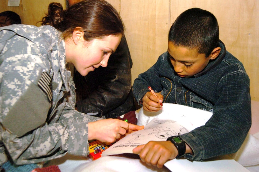 Army Sgt. Heather Slater Provides Care to Afghan Boy at Bagram Air Base Hospital