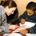 Army Sgt. Heather Slater Provides Care to Afghan Boy at Bagram Air Base Hospital