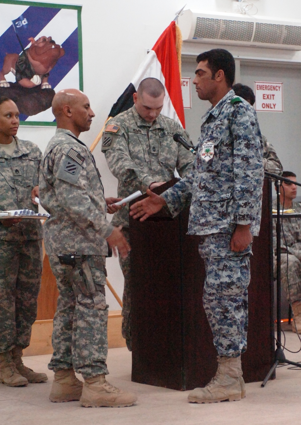 Army Command Sergeant Major Congratulates Iraqi Police Graduate