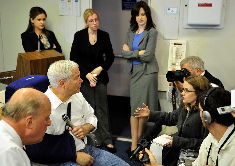 Defense Secretary Gates Answers Reporter's Question Aboard Military Aircraft
