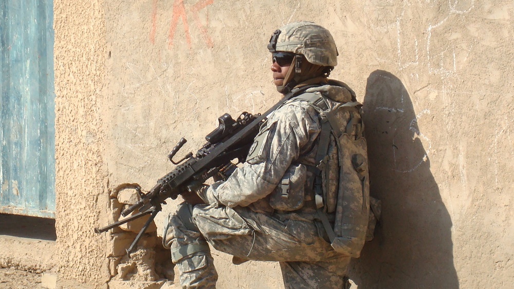 Texas Soldier Stands Watch During Patrol in Baghdad