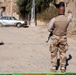 Sons of Iraq Member Directs Traffic at Baghdad Checkpoint