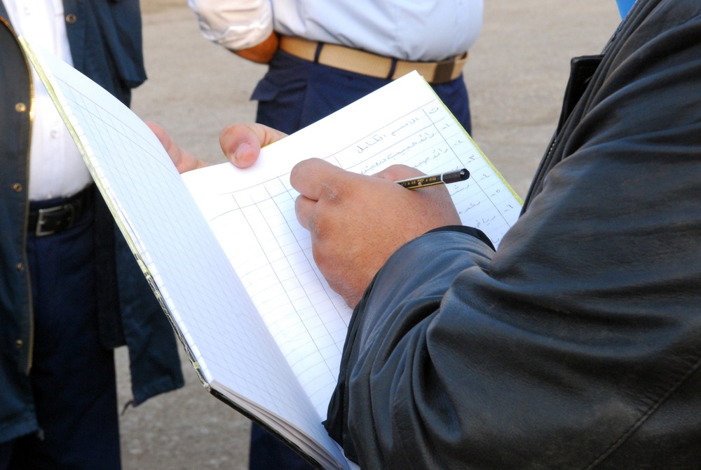 Iraqi Police Conduct Roll Call at Adil Station in Baghdad