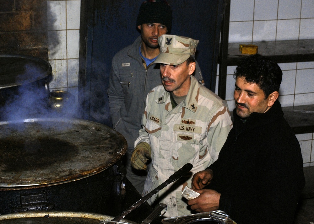 U.S. Navy Petty Officer Mentors Afghan National Army on Food Service Improvements