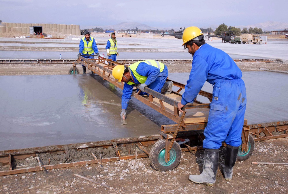 Afghan Workers Lay Concrete at Forward Operating Base Fenty