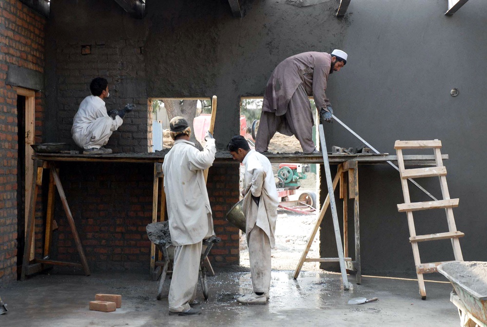 Afghan Workers Contribute to Construction at U.S. Military Base in Afghanistan