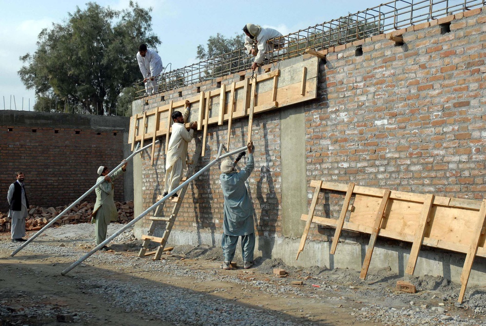 Afghan Workers Construct Building at Forward Operating Base Fenty