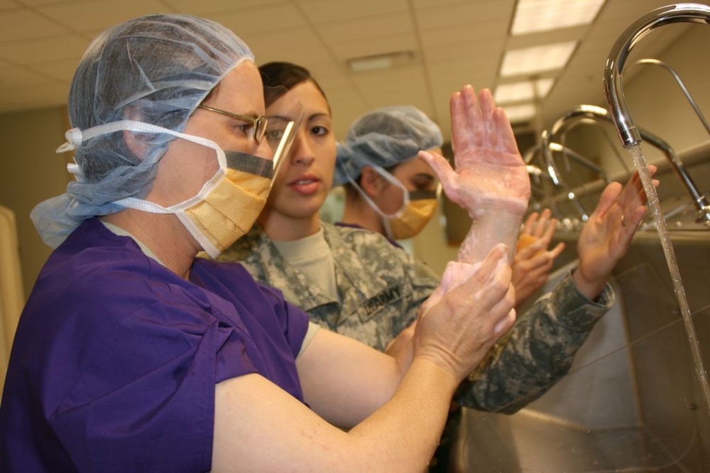 Army Instructor Teaches Soldier Surgical Scrub Technique