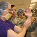 Army Instructor Teaches Soldier Surgical Scrub Technique