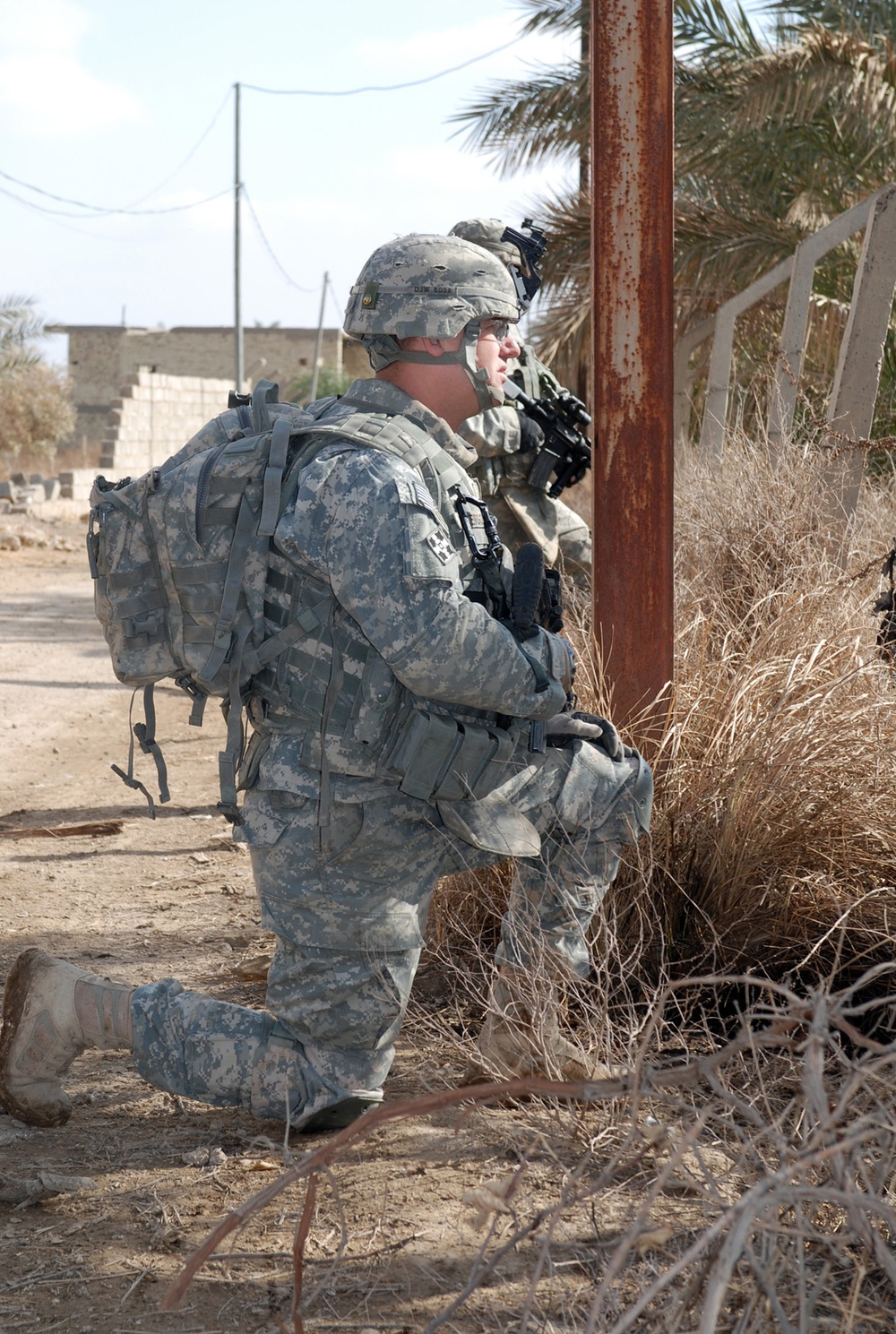 Armored Soldier Provides Security During Mission in Rural Iraq