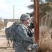 Armored Soldier Provides Security During Mission in Rural Iraq