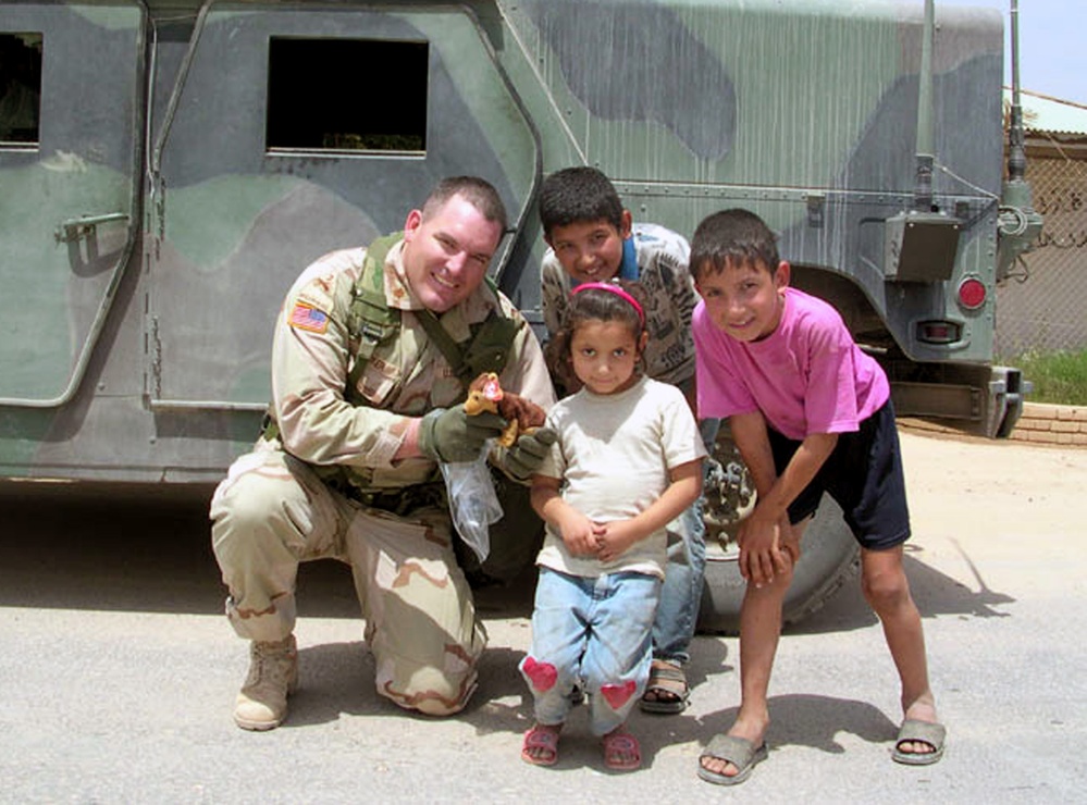 Army Officer Gives Iraqi Girl First Toy in Beanies for Baghdad Program