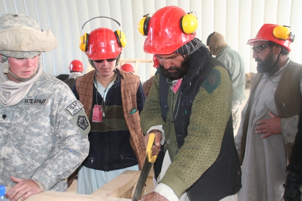 Army Spc. Teaches Afghans Carpentry Skills at Forward Operating Base