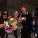 Army Soldier Poses with Wrestling Legends at Bagram Air Base