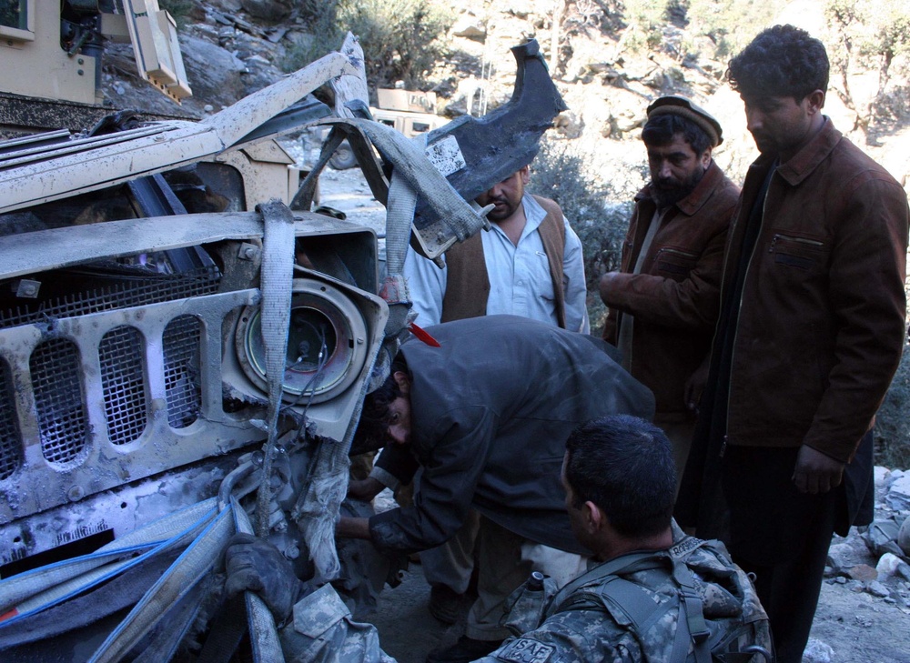 U.S. Army, Afghan Truck Drivers Collaborate to Recover Damaged Vehicle in Kunar, Afghanistan