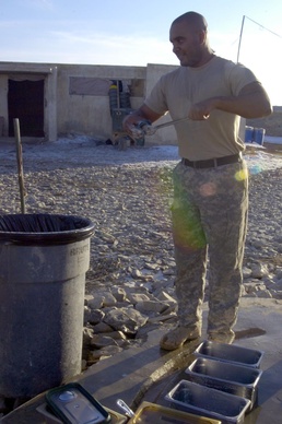 Army Cook Cleans Dishes at Firebase Nawa in Afghanistan