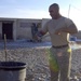 Army Cook Cleans Dishes at Firebase Nawa in Afghanistan
