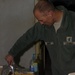 Army Officer Enjoys Meal at Firebase Nawa in Afghanistan