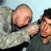 Army Medic Treats Afghan Boy's Ear Ailment in Ghazni Province