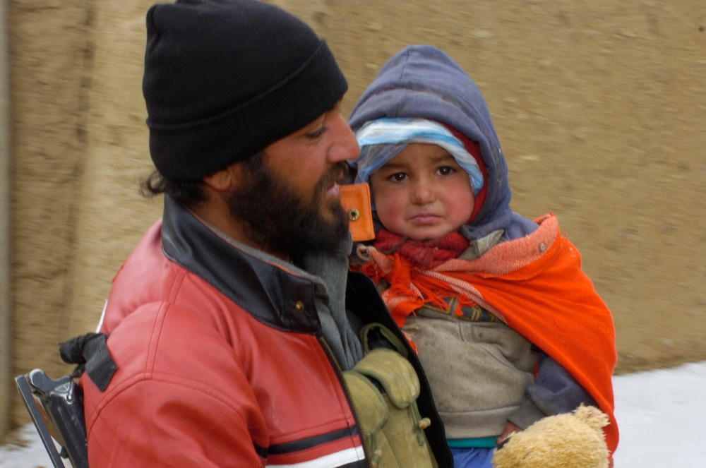 Afghan Policeman Rescues Child at Clinic in Ghazni Province