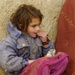 U.S. Soldier Shares Cookies with Afghan Girl at Clinic