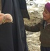 Afghan Boy Receives Stuffed Animals from Security Forces