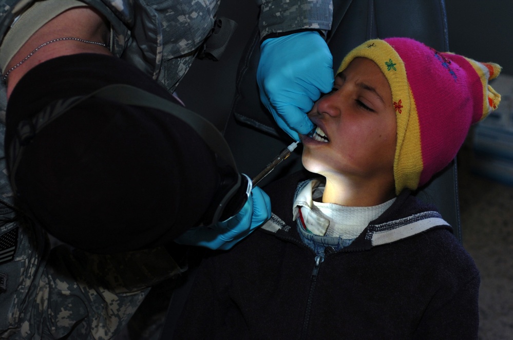 U.S. Army Dentist Provides Care to Iraqi Child