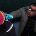 Iraqi Dentist Provides Dental Care to Child at Baghdad School