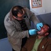 Iraqi Dentist Provides Dental Care to Child at Baghdad School