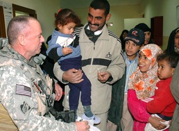 Navy Commander Connects with Iraqi Families at New Health Clinic
