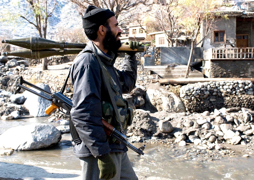Afghan Police Officer Patrols with Rocket-Propelled Grenades