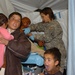 U.S. Army Medic Provides Care to Afghan Mother at FOB Naray Aid Station