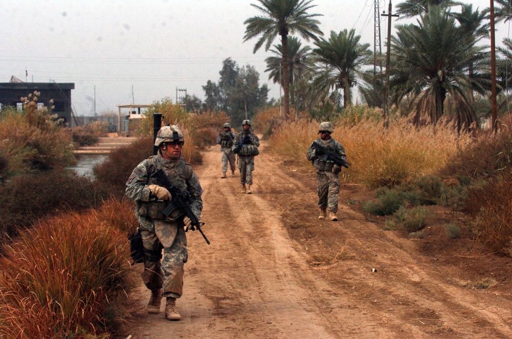 Mortarmen Patrol Road Near Pump Station in Iraq