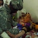 Army Medic Treats Injured Iraqi Girl After Mortar Attack