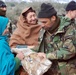 Afghan Soldier Provides Clothing to Girl During Humanitarian Visit
