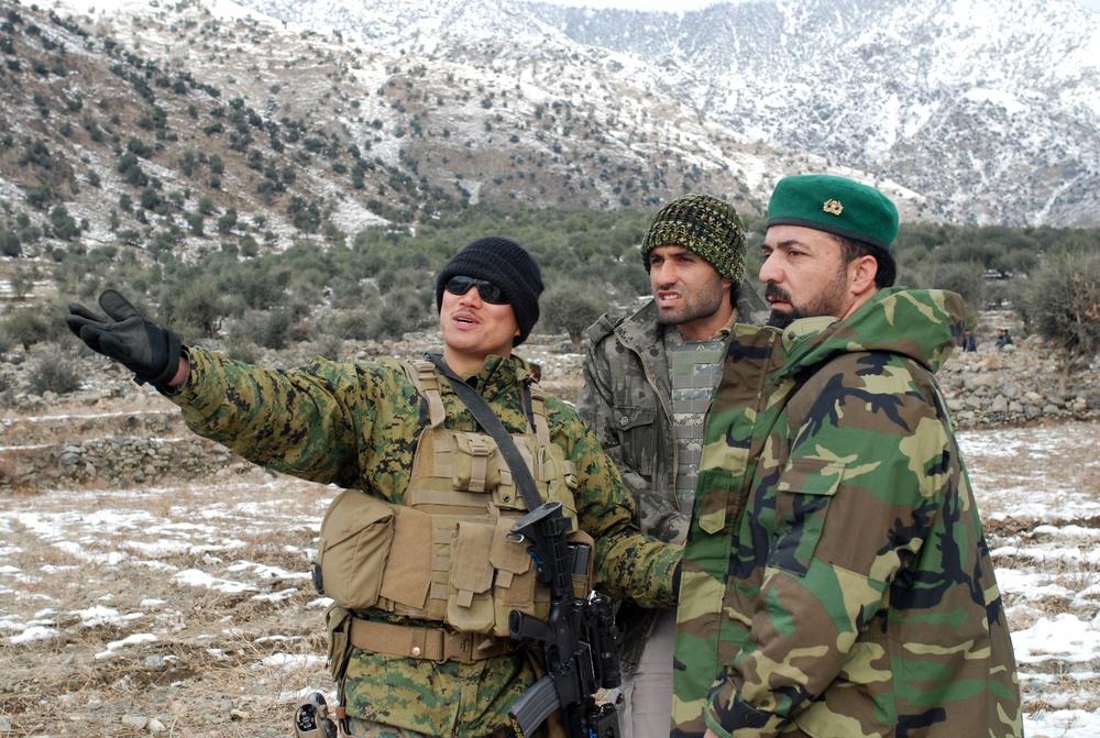 U.S. Navy Petty Officer Advises Afghan Army Captain on Medical Assistance in Kunar Province