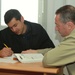 Afghan Air Force Trainee Receives English Lessons from U.S. Contractor