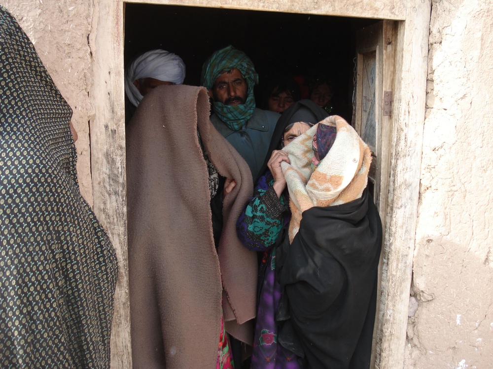 Afghan Grandmother Cradles Newborn Grandchild as Mother Transported to Hospital