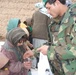 Afghan Soldier Distributes Candy to Children in Herat Province