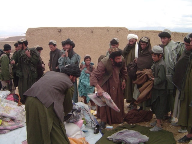 Afghan Villagers Receive Aid Supplies from Security Forces