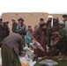 Afghan Villagers Receive Aid Supplies from Security Forces