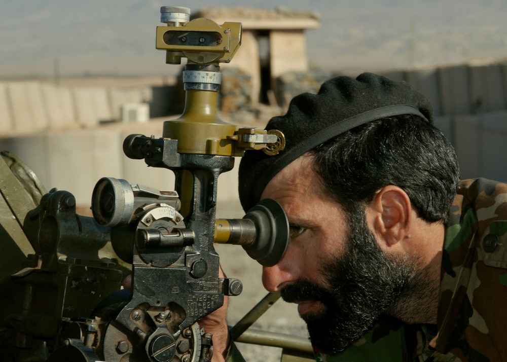 Afghan Army Sergeant Sights D-30 Howitzer at Forward Operating Base
