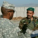 U.S. Sergeant Mentors Afghan Army Captain on Howitzer Firing