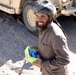 Afghan Villager Receives Radio, Free Health Care from Afghan Army