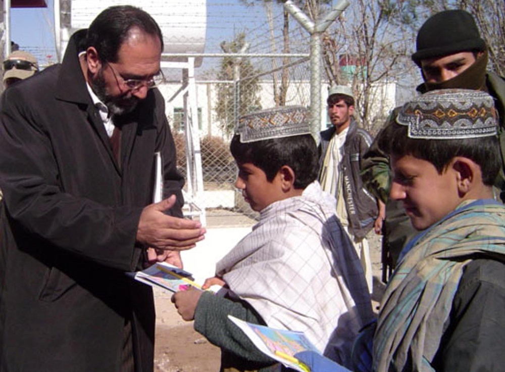 Afghan Girl Receives Coloring Book from Army Soldiers
