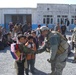 Coalition Soldier Greets Afghan Boys at Orphanage in Kandahar