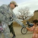 U.S. Army Major Distributes Candy to Afghan Villagers in Humanitarian Outreach